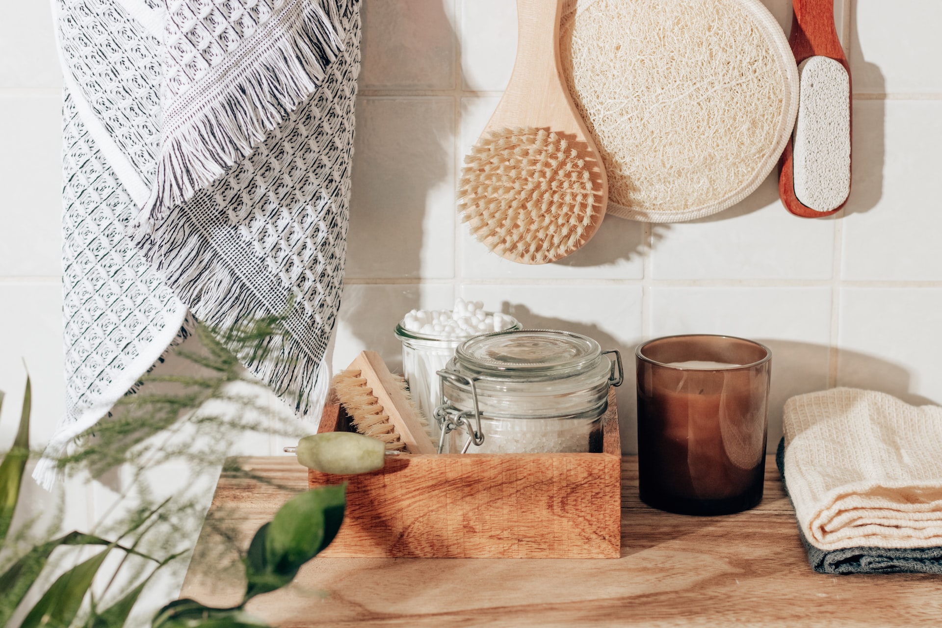 brown wooden chopping board beside clear glass jar