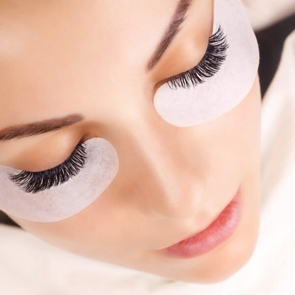 A close-up image of a woman's face highlighting her long and thick eyelashes after getting eyelash extensions at heya Spa in Kuwait, which gives her an attractive appearance.