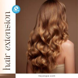 A woman with long, wavy blonde hair, shown from the back, with hair extensions