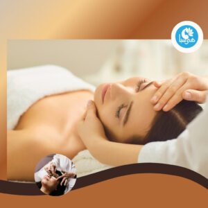 A woman receiving a pain-relieving massage on her face and head at Heya Spa